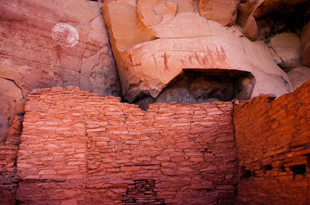 Pictographs above ruin wall at Honanki Heritage Site. 