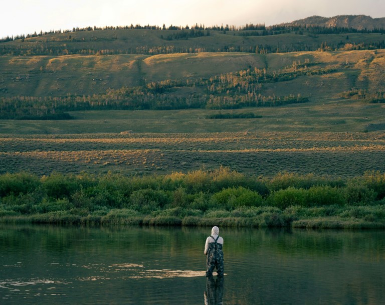 Man enjoys the views and the fishing while on Green River Lake.
