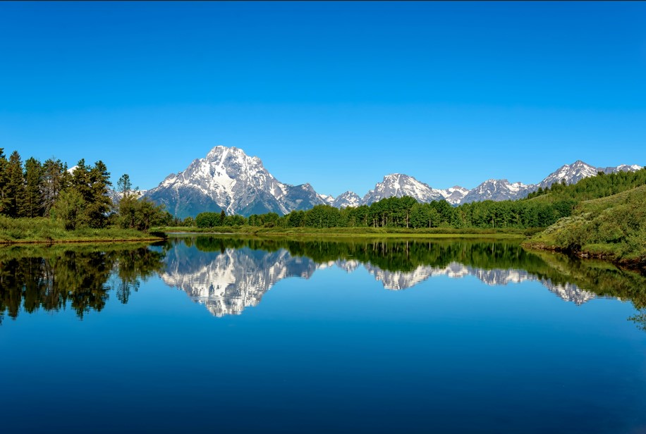 Beautiful scene of mountains reflected in a lake in WY.