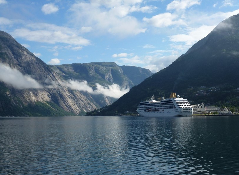 A cruise ship sailing through the fjords.