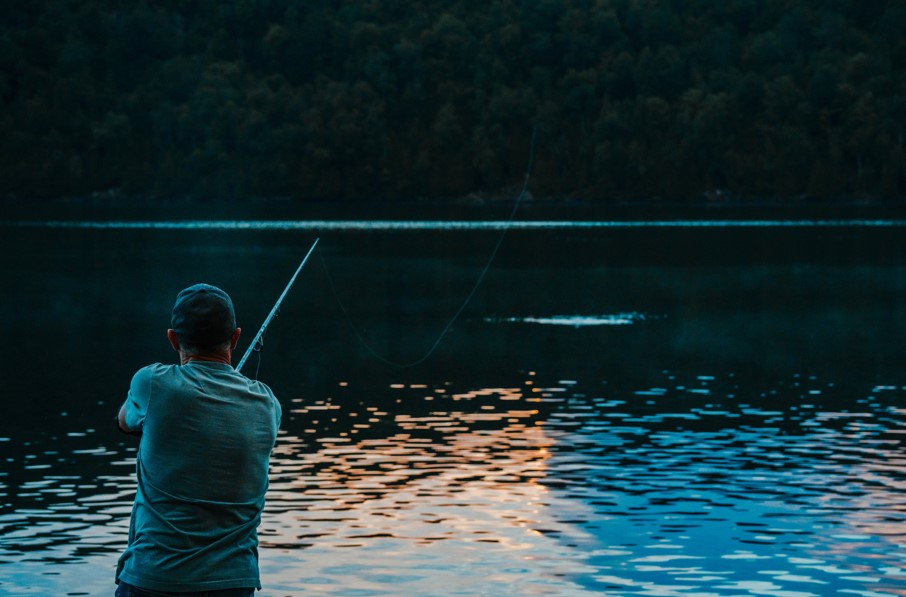 Casting a fishing line in the early morning hours 