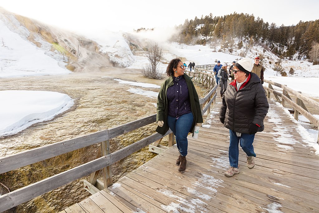 Friends walk along the boardwalks at Palette Spring