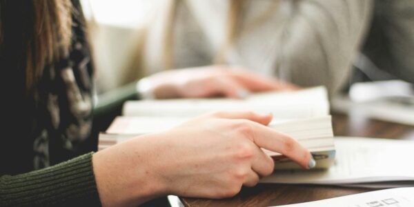Person holds the Bible open
