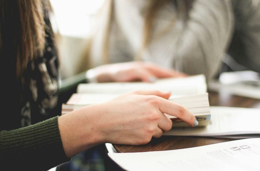 Person holds the Bible open