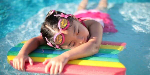 Young Gril enjoys laying on a float at a water park in baton rouge lousinana